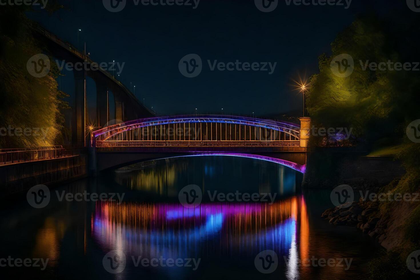 A bridge lit up at night with colorful lights photo