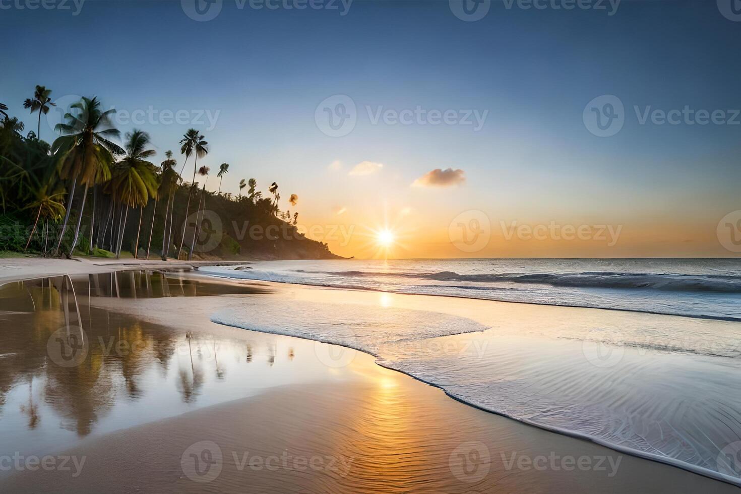 The sun sets over the ocean and the beach photo