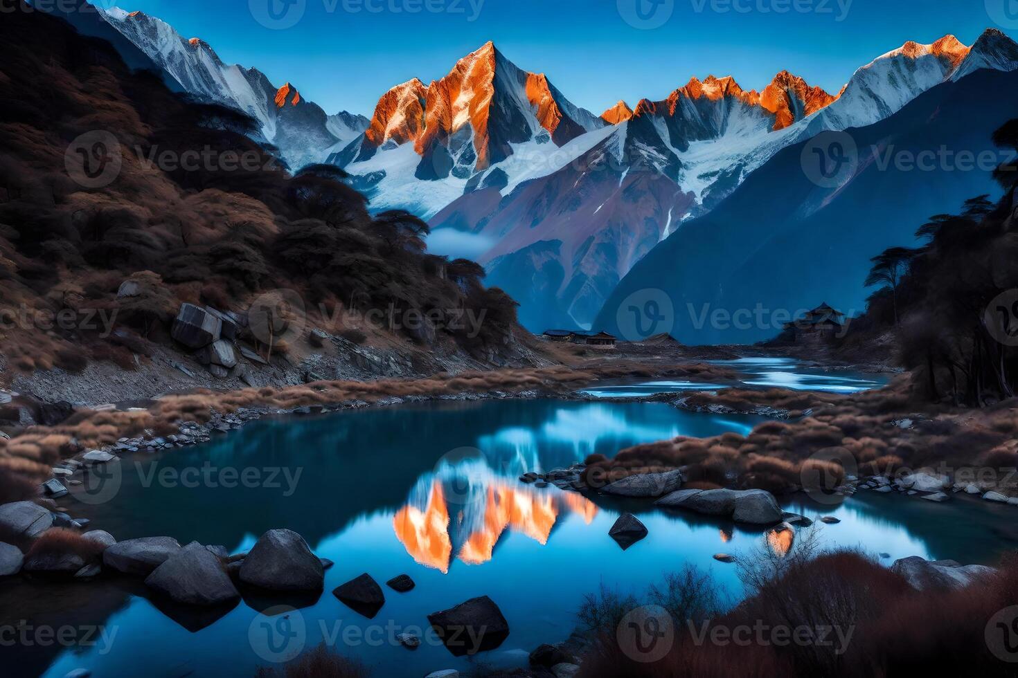 A mountain range is reflected in a river at sunset photo