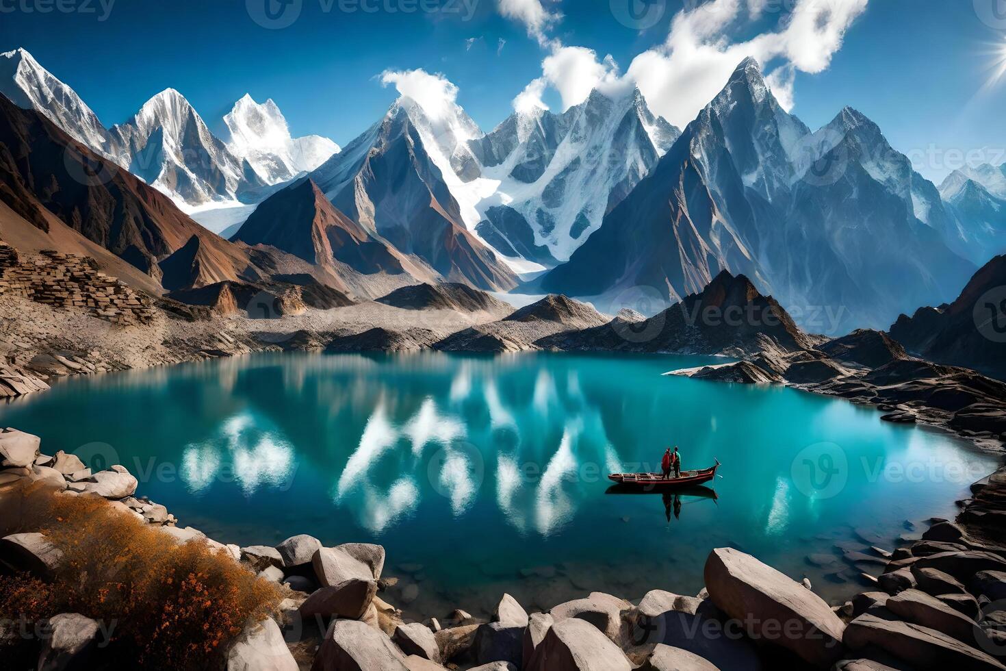 A man is standing on a boat in front of a mountain lake photo