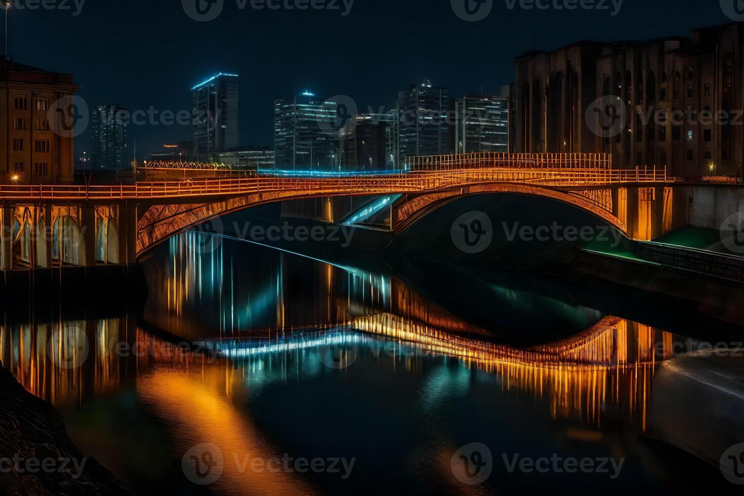 A bridge over a river at night with city lights reflected in the water photo