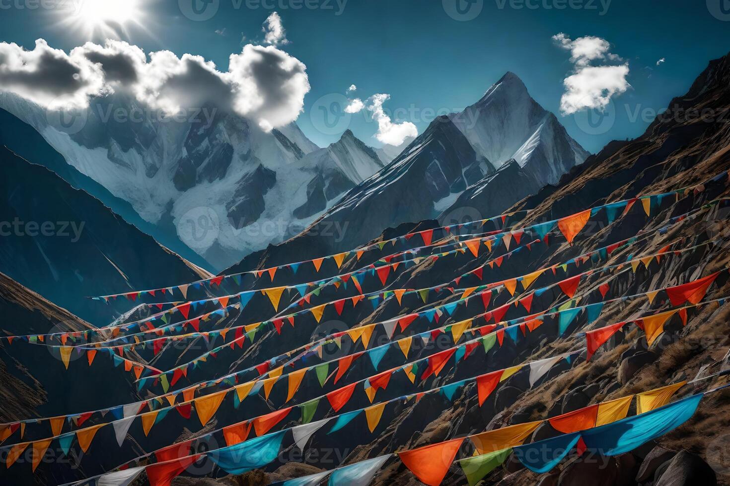 Colorful flags are hanging in the air in front of mountains photo