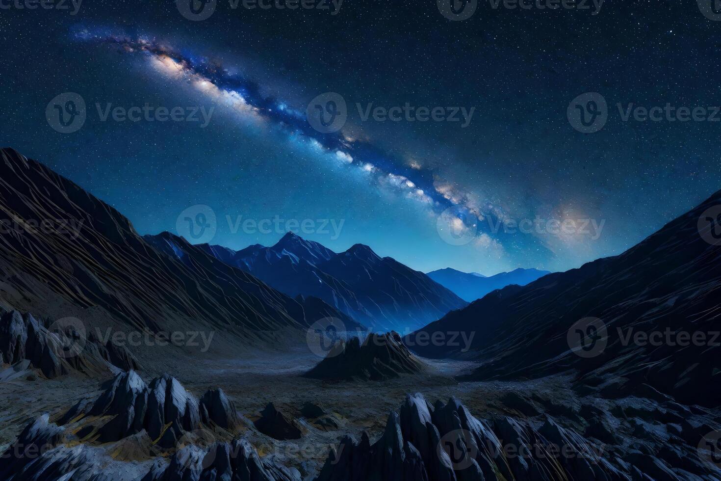 The milky way over mountains and rocks photo