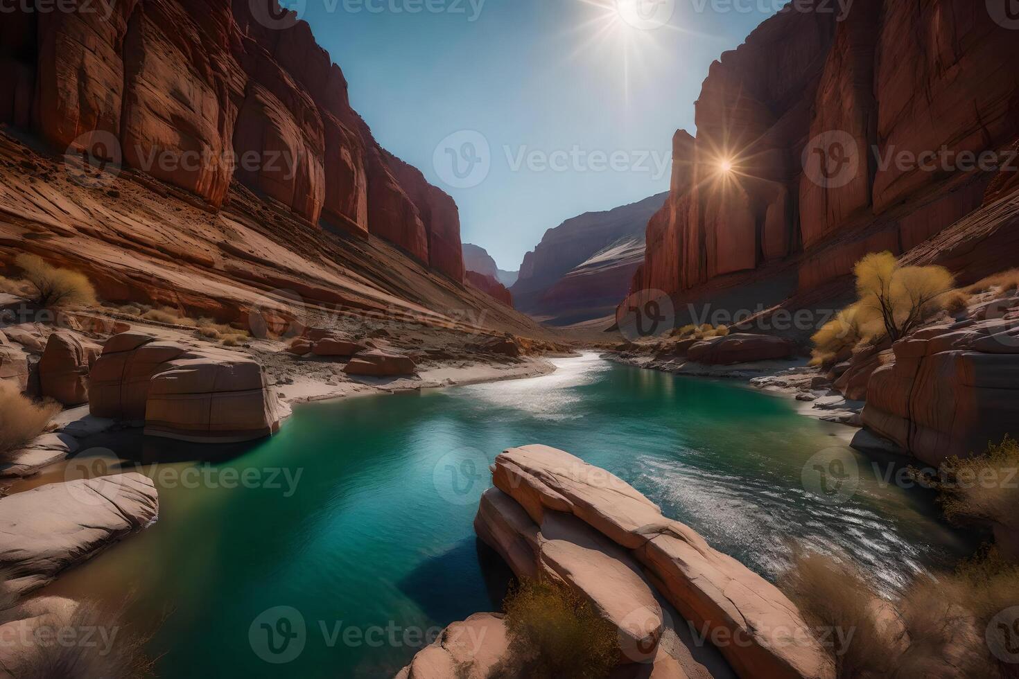 The sun shines over a river in a canyon photo