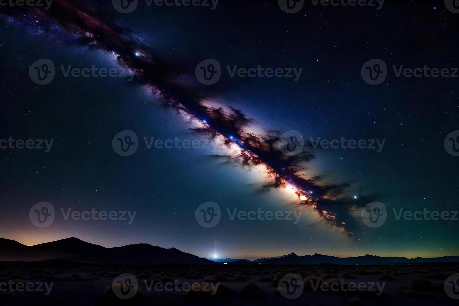 The milky way over the desert at night photo