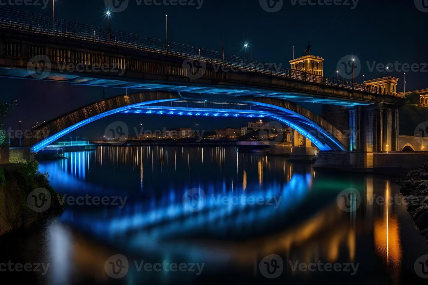 A bridge over a river at night with blue lights photo