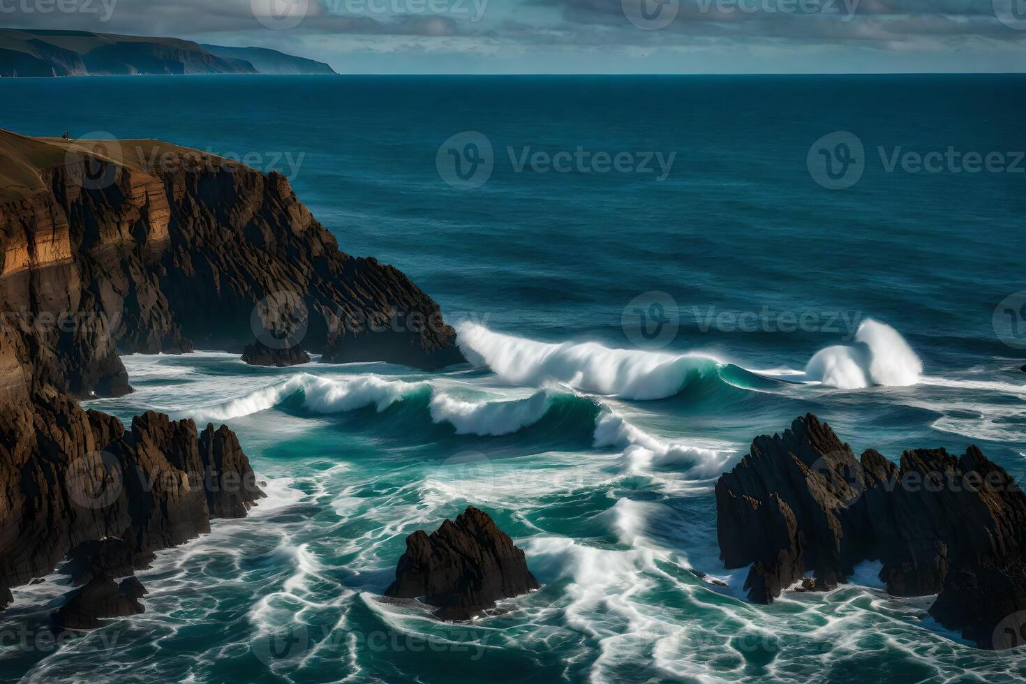 Waves crash against the cliffs of the coast photo