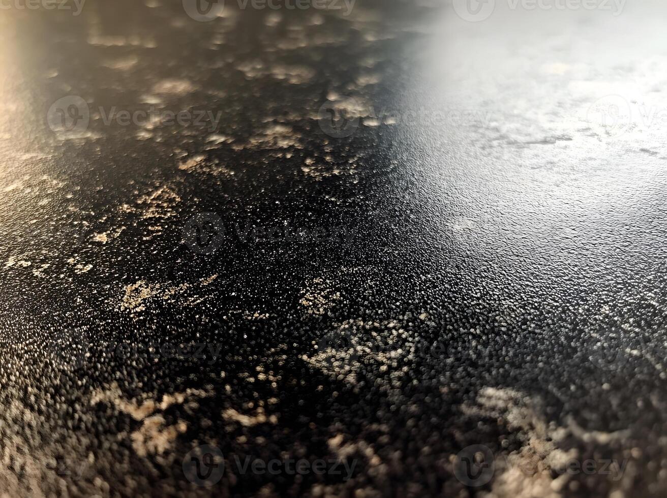 Close-up view of a dark surface with speckles. photo