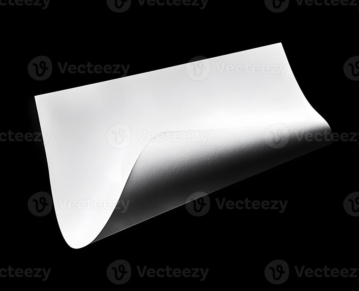 Blank sheet of paper with a curled corner. photo