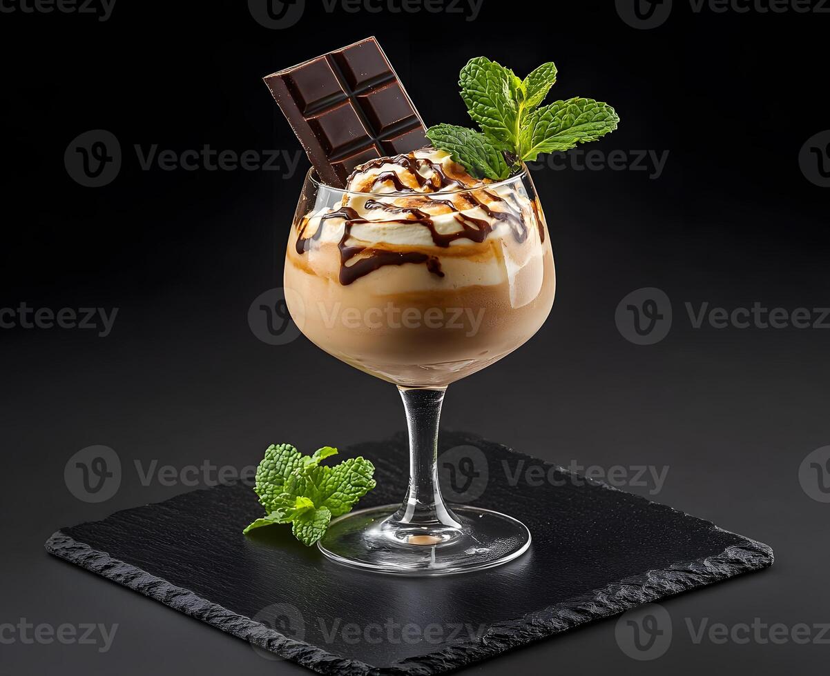 Chocolate liqueur dessert drink garnished with chocolate and mint. photo