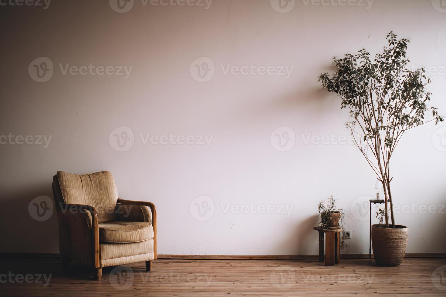 Simple room with a single armchair and potted plant. photo