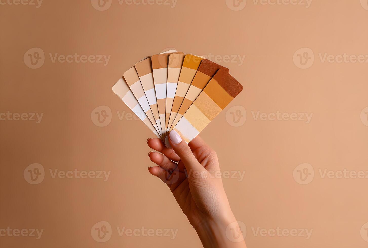 Hand holding a color palette of various shades. photo
