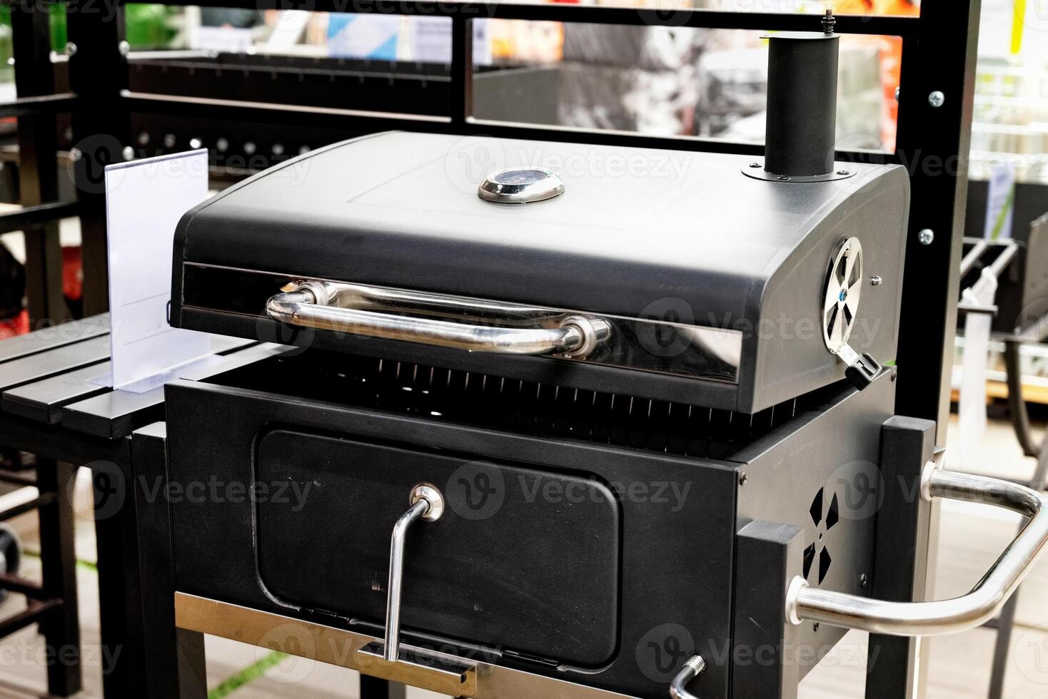 Outdoor modern black grill on display in a retail store. Temperature grill. photo