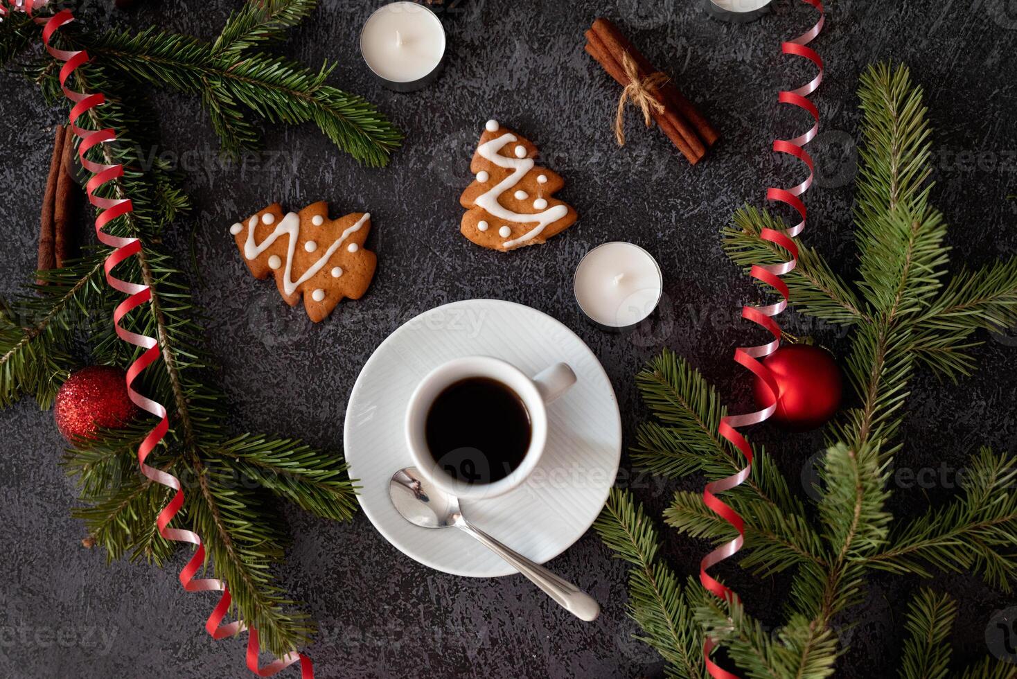 A simple and elegant flat lay depicting Christmas decorations candy canes, gingerbread cookies, cinnamon, pine sprigs photo