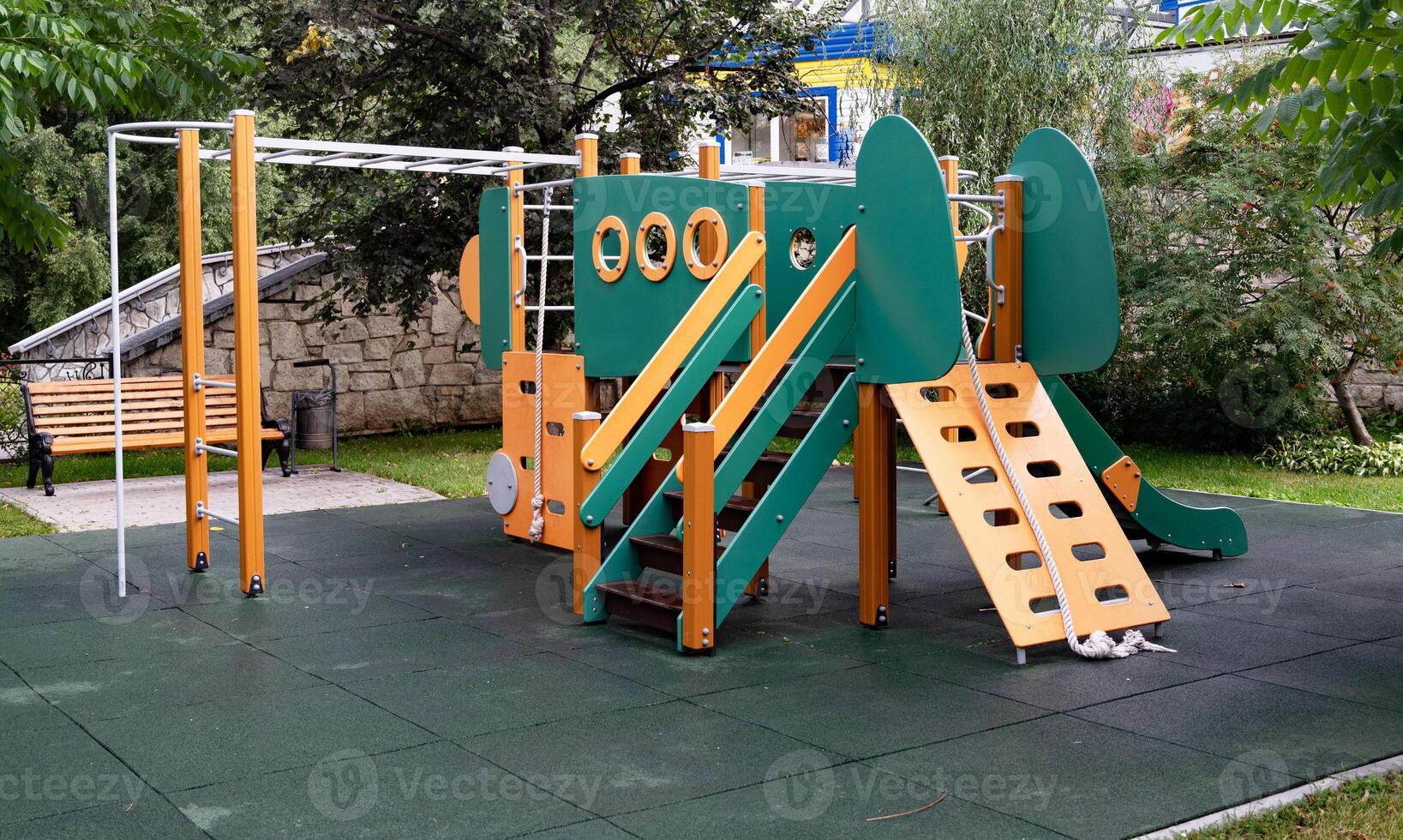 Colorful children's playground in a green park. photo