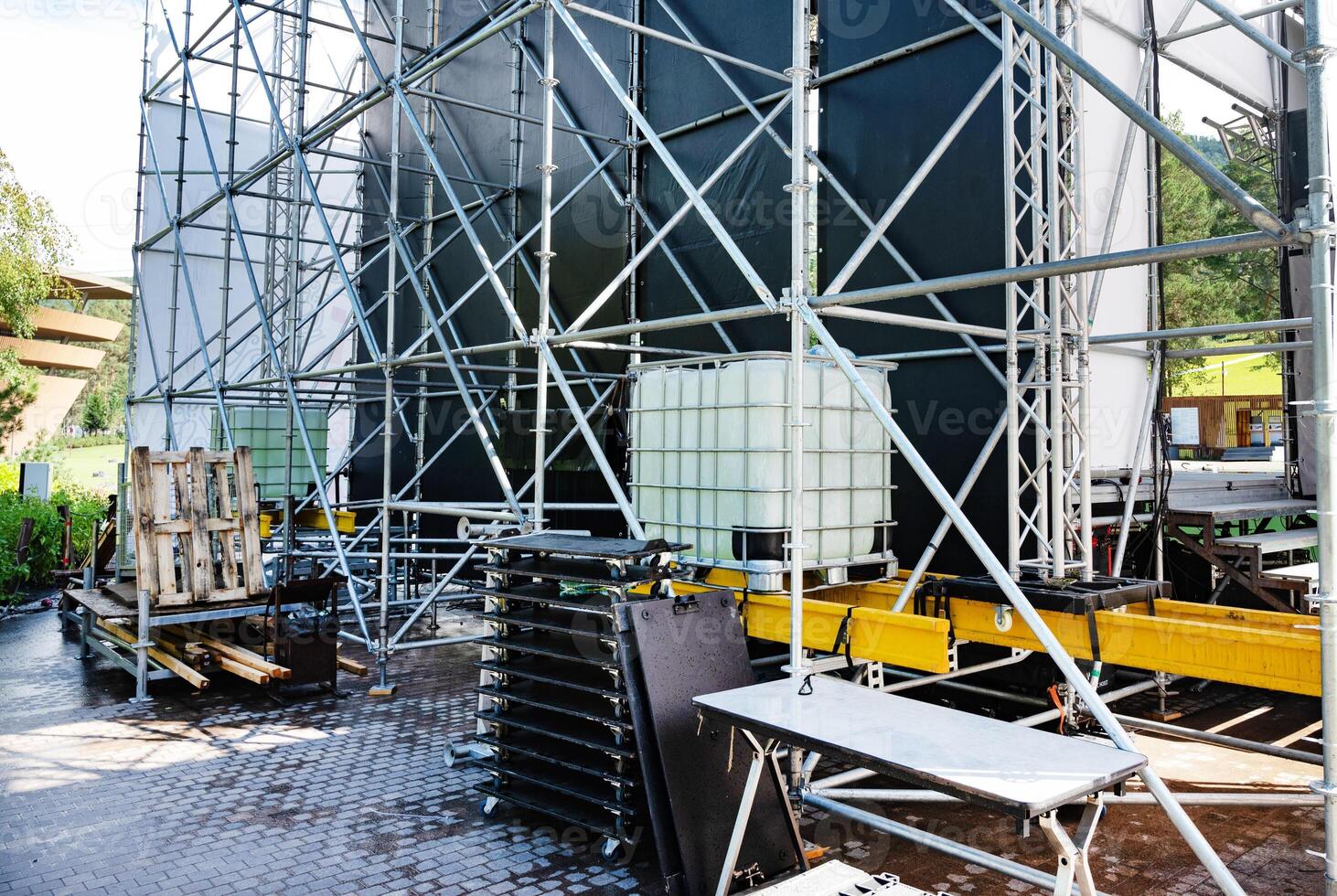 Backstage equipment and scaffolding for an outdoor event setup. photo