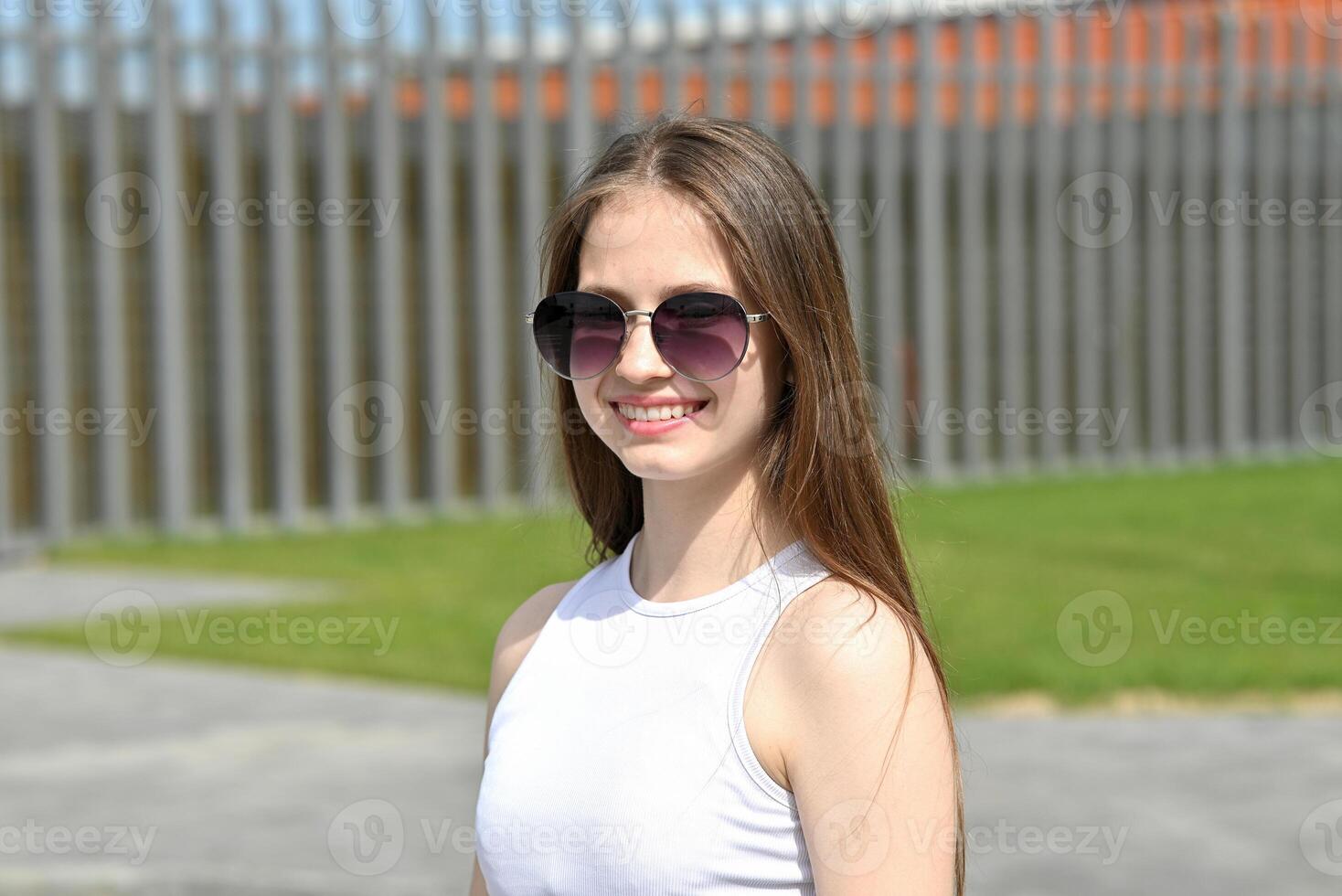 City life scene with a woman in black and white, poised and relaxed, ready to continue her day. photo