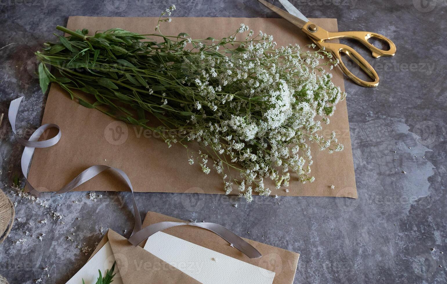 The arrangement suggests a thoughtful, handcrafted invitation or greeting card setting. photo