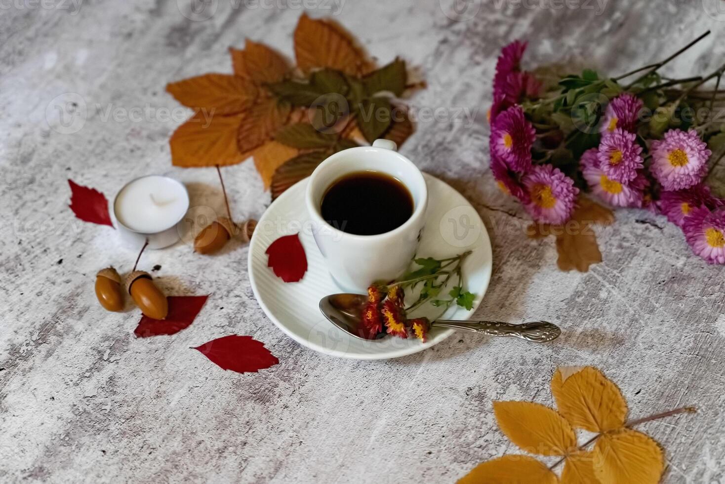 hot steaming cup of coffee scarf on wooden table background. Seasonal, morning coffee, Sunday relaxing and still life concept. photo