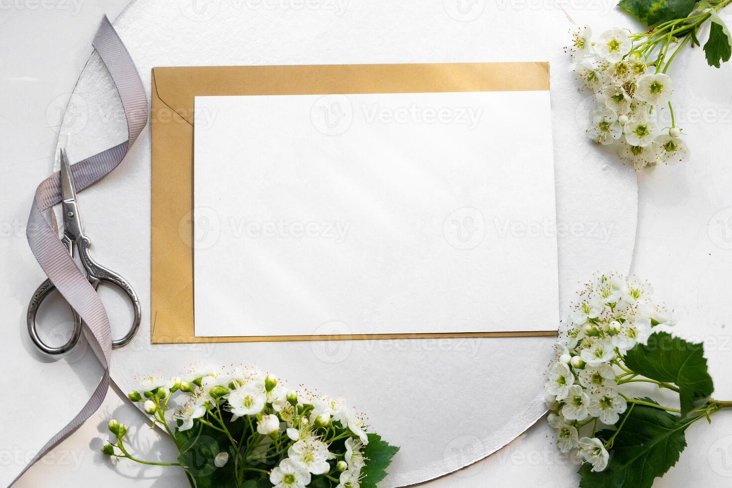 The image captures a quiet moment of preparation, where someone is carefully wrapping flowers and organizing stationery, conveying a sense of mindfulness and attention to detail in a cozy photo