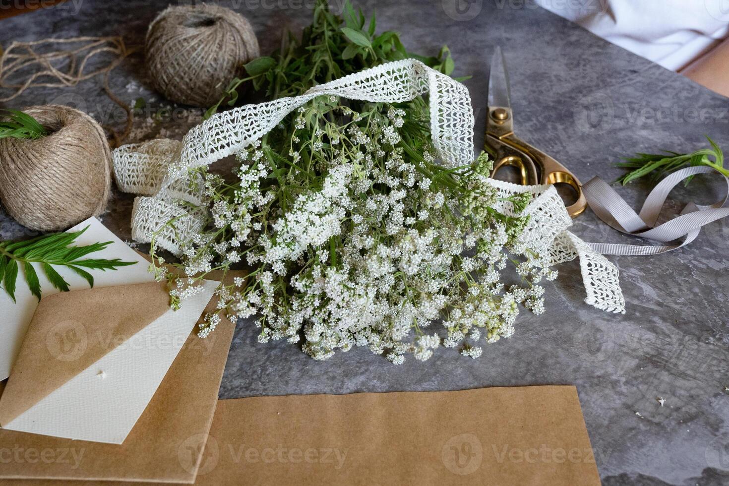 Crafting with natural elements using freshly picked flowers in a creative workspace photo