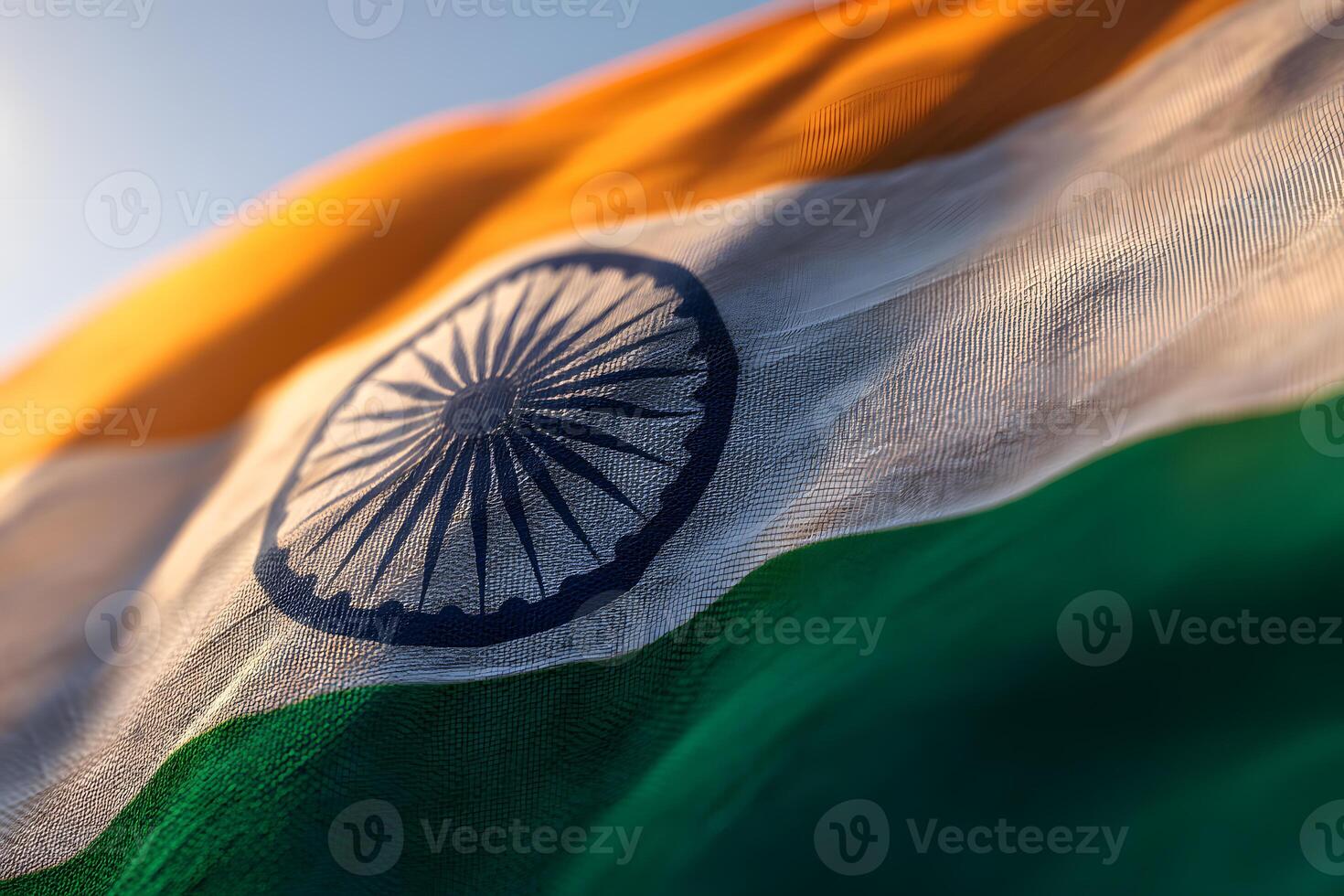 Closeup realistic view of the Indian national flag with bold colors and crisp Ashoka Chakra on fabric waving in wind photo