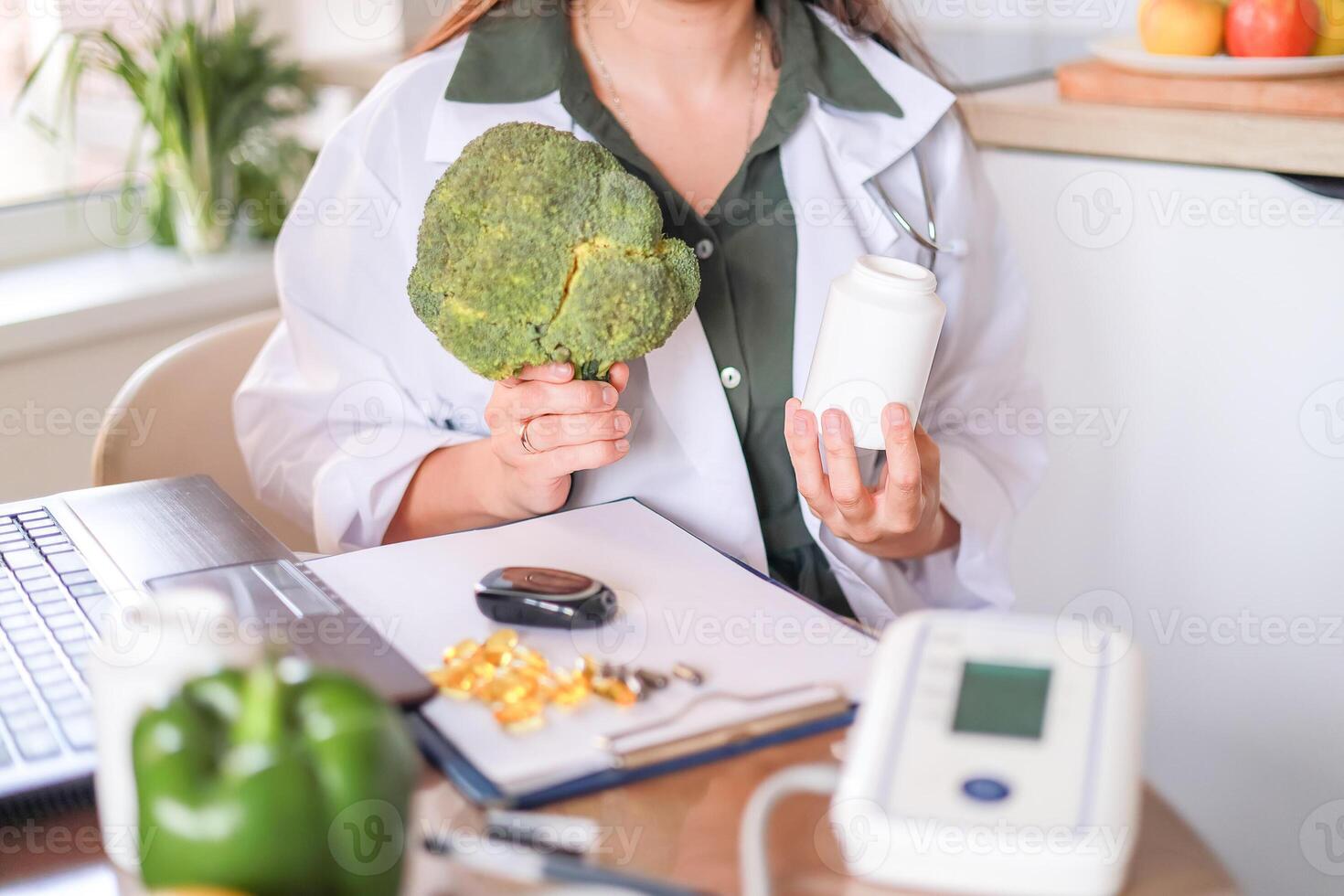 Doctor shows broccoli and white jar with supplements for health maintenance and weight control. Medical consultation and wellness concept. Mockup, template photo