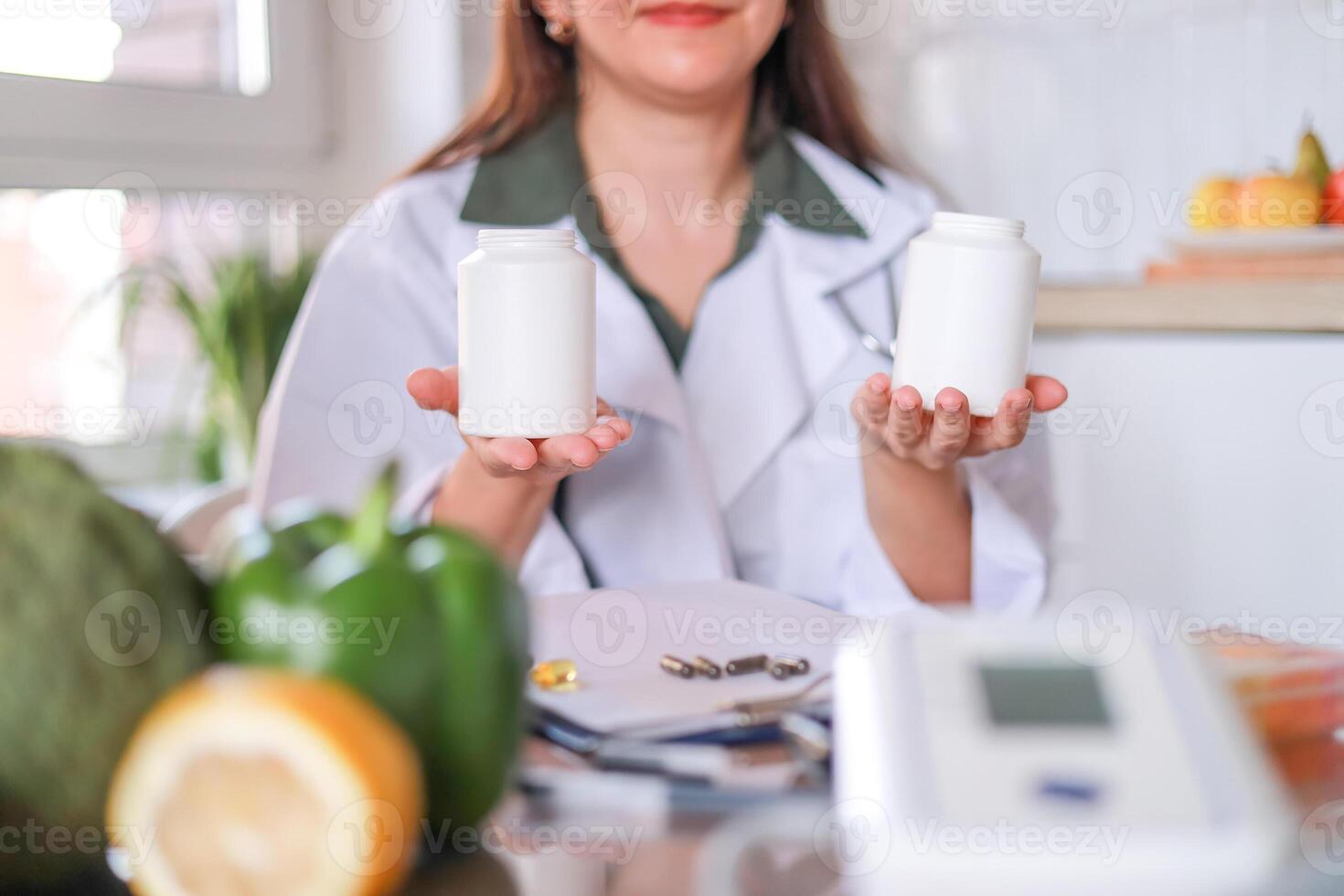 nutritionist demonstrates jars of dietary supplements against a background of healthy products. Mockup. zinc, vitamin d. dietetics concept, health. photo