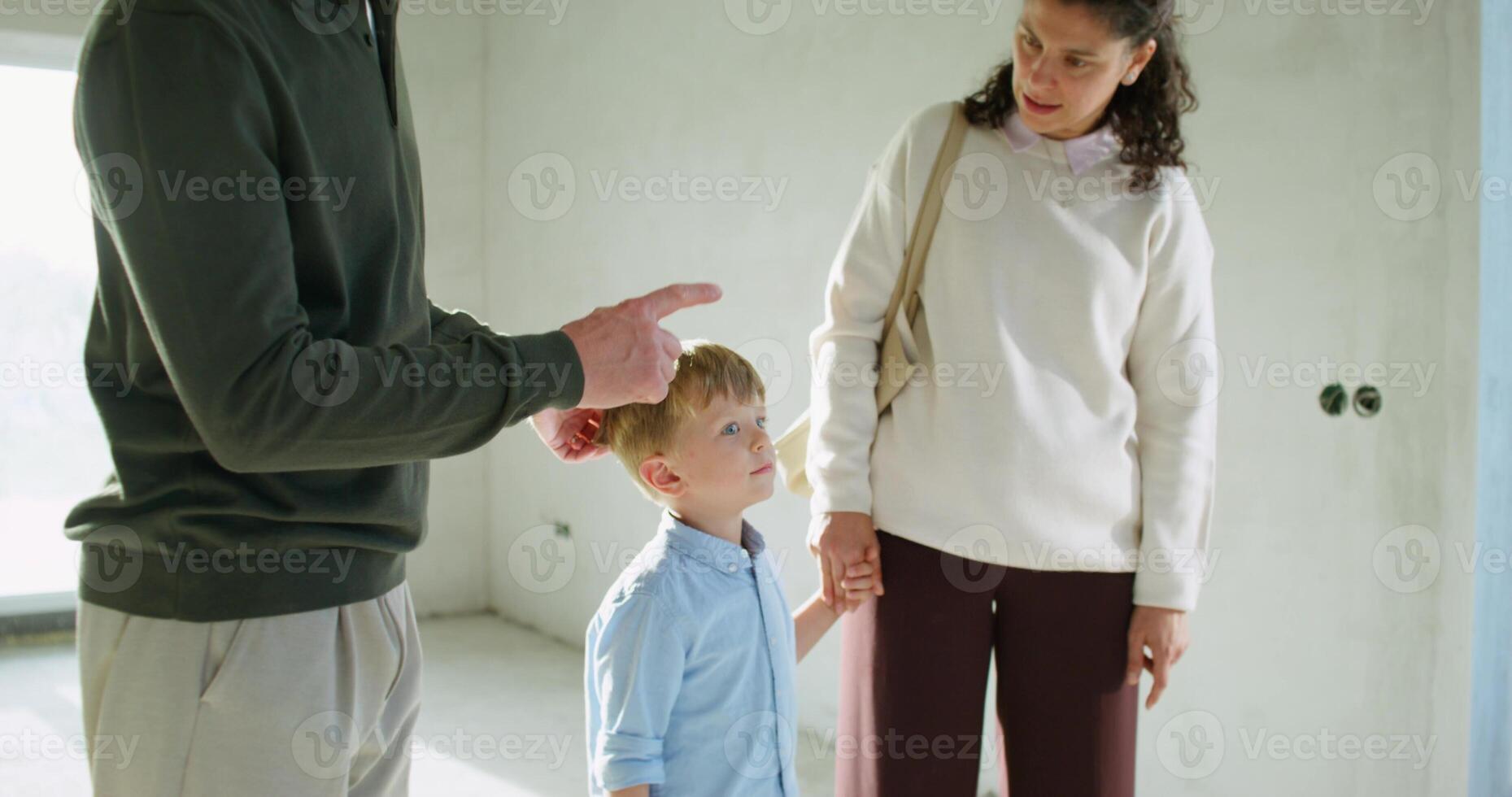 Buyers inspect and discuss the house with a realtor before buying photo