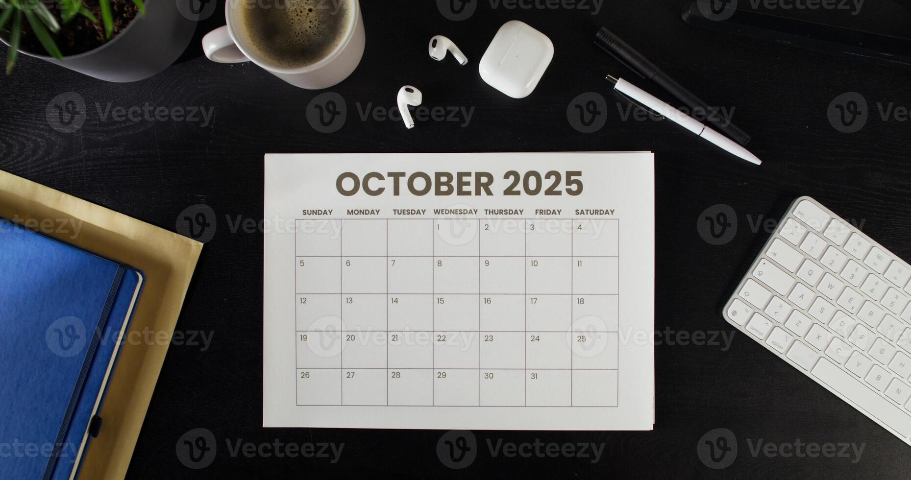 October 2025 calendar on the desk photo