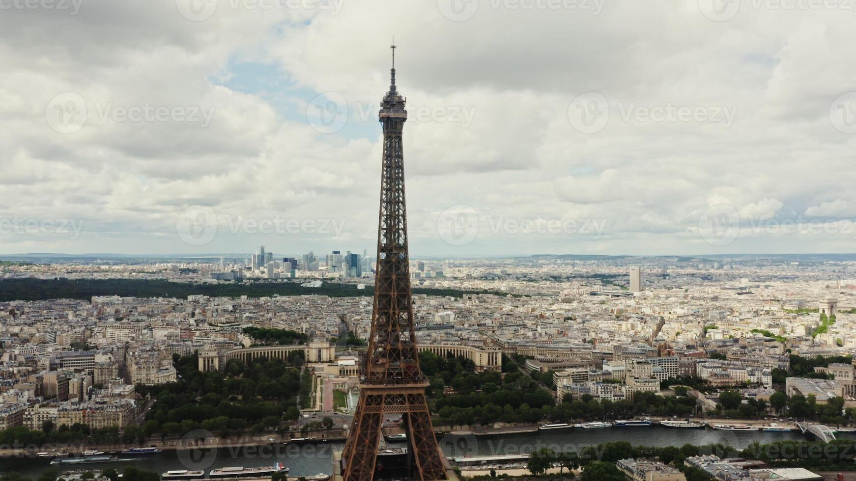 Cityscape of Paris from a bird's eye view. Close-up of the spire of the Eiffel tower overlooking the Seine and the cityscape. France Paris photo