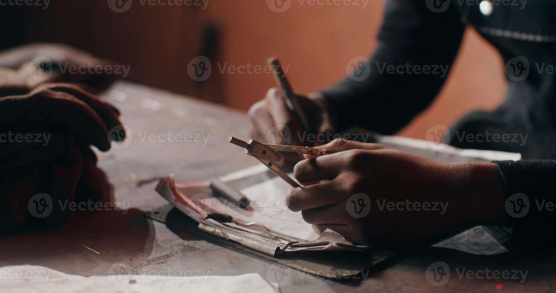 A person working on a piece of paper photo