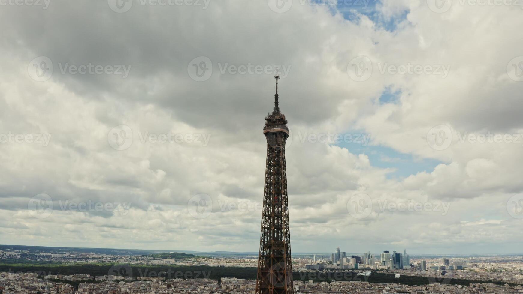The top of the Eiffel Tower, aerial view from a drone on a cloudy day. The spire of the Eiffel Tower close-up. France Paris photo