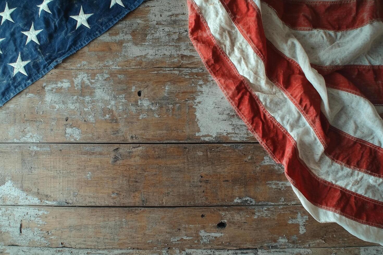 Display of an Old American Flag on a Rustic Wooden Surface During Daylight Hours photo