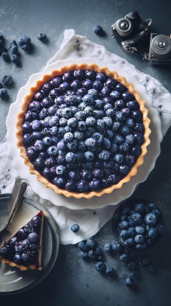 Fresh Blueberry Tart With Creamy Filling Displayed on a White Plate Surrounded by Scattered Blueberries photo