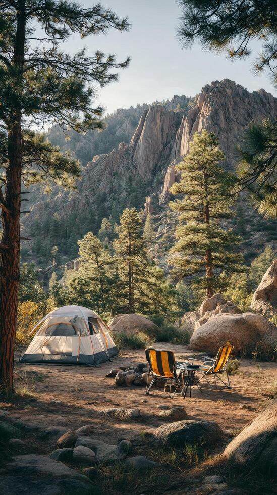 Serene Camping Spot in Rocky Mountains Surrounded by Tall Trees During Golden Hour photo
