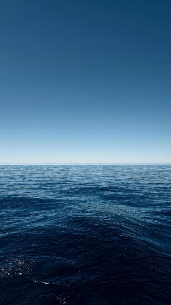 Tranquil Ocean View Under a Clear Blue Sky at Midday. photo