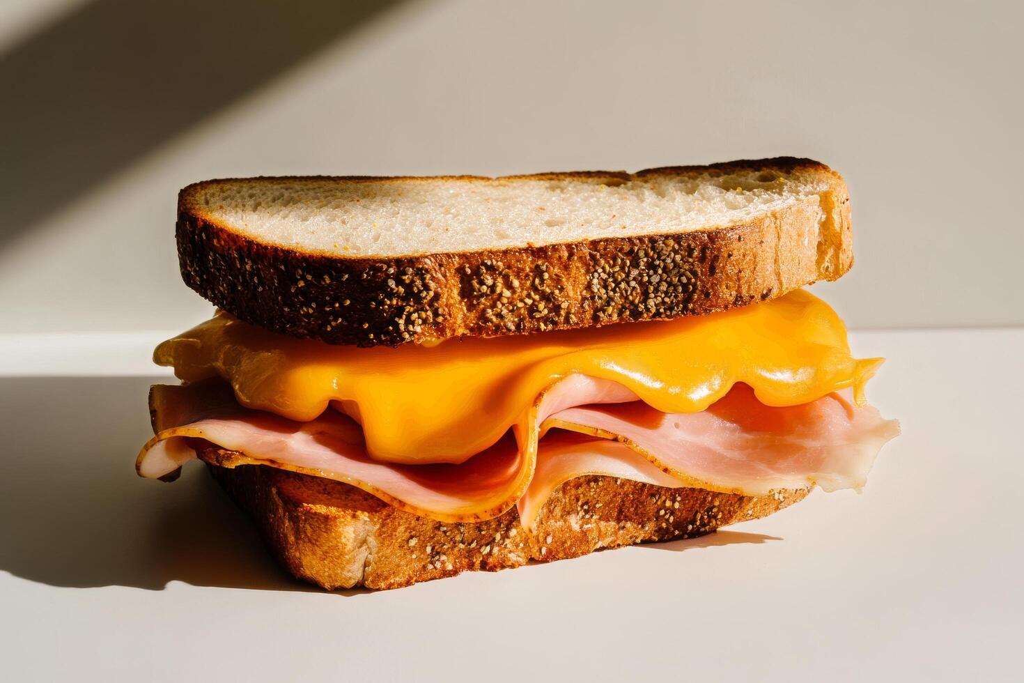 Delicious Ham and Cheese Sandwich on Rustic Bread With Melted Cheddar. photo