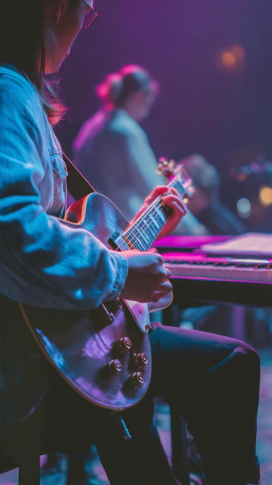 Musician Playing Electric Guitar During Live Performance in Vibrant Venue at Night photo