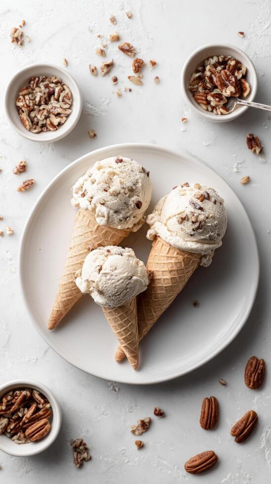 Delicious Pecan Ice Cream Served in Waffle Cones With Nuts on a Light Surface. photo