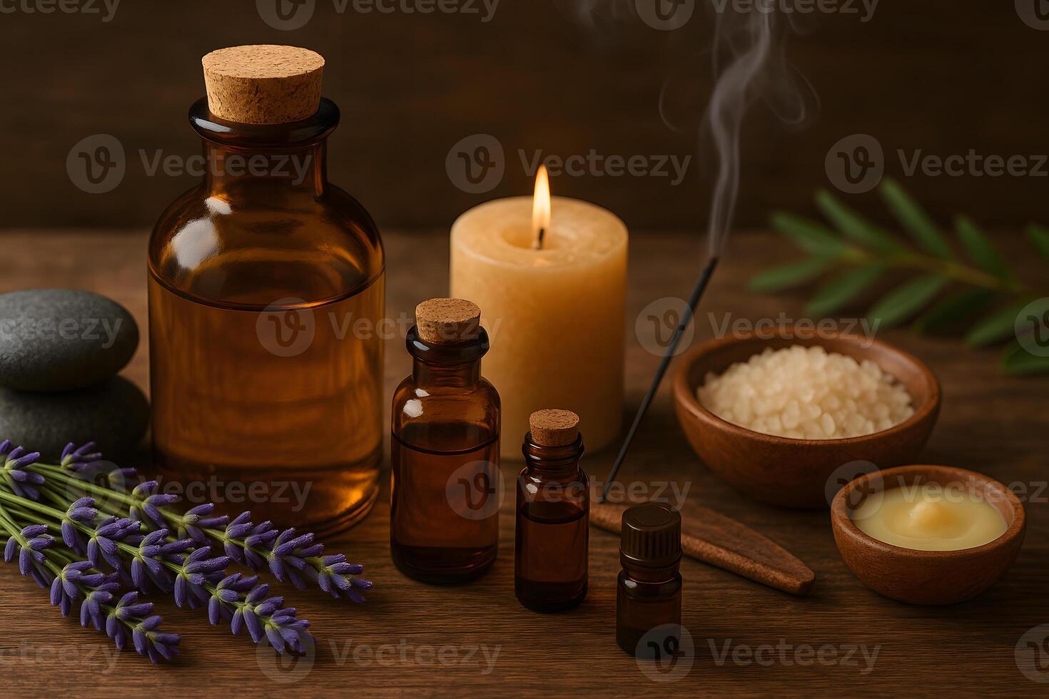 Essential oils and candles on a wooden table photo