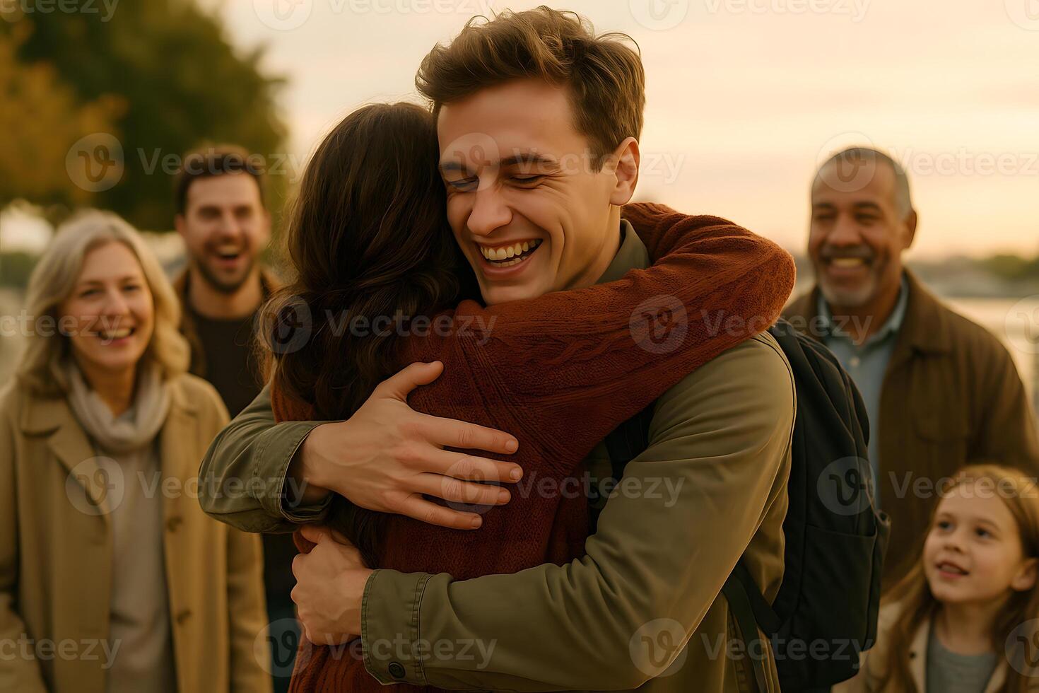 A man hugging a woman and smiling with his family photo