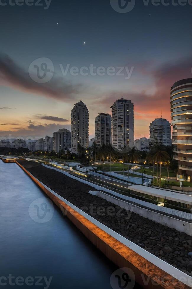 A city skyline at sunset with water and buildings photo