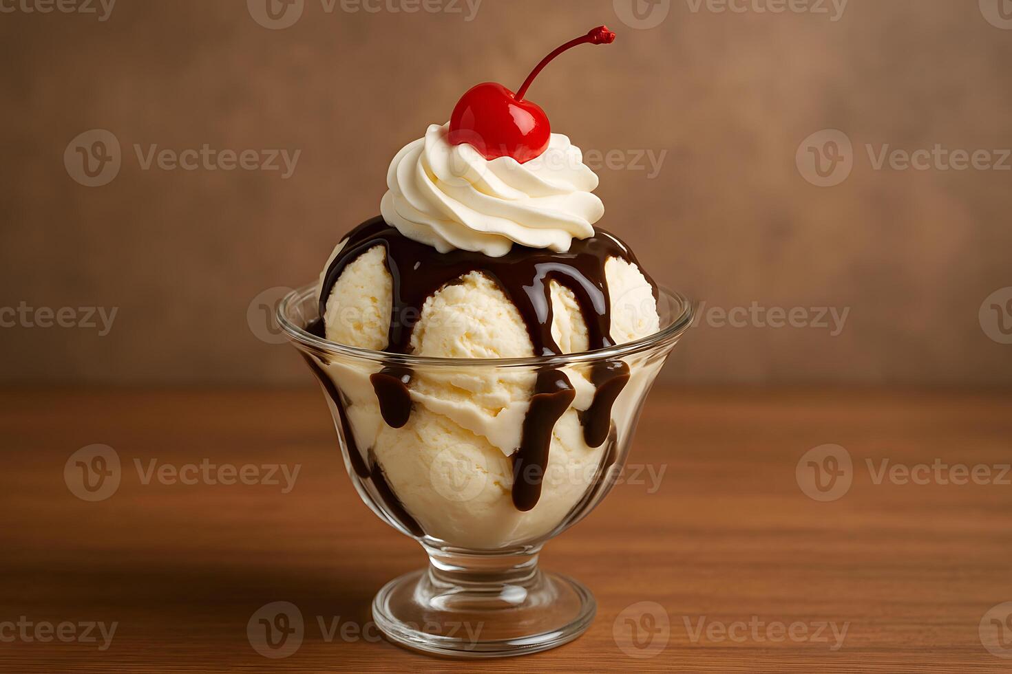 A glass bowl with a sundae with whipped cream and a cherry on top photo