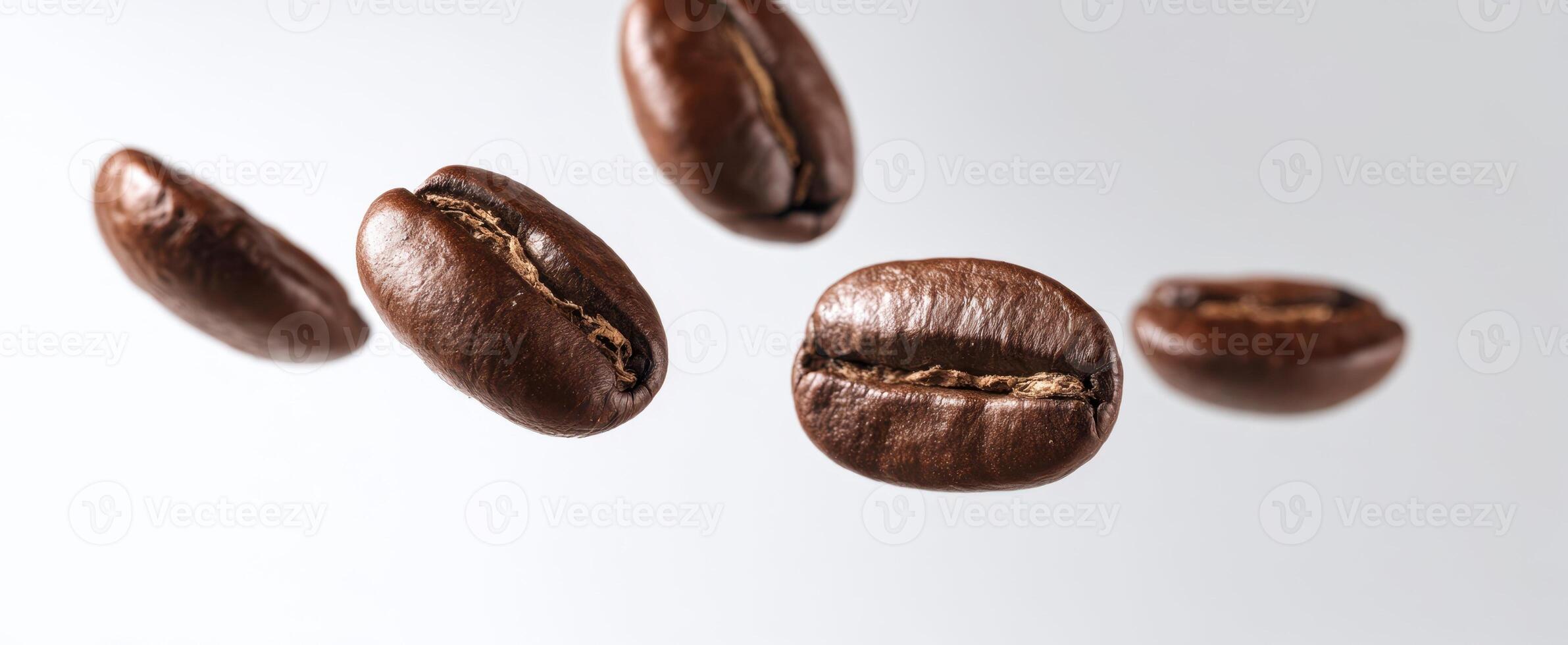 The floating coffee beans in mid-air against a light background. photo