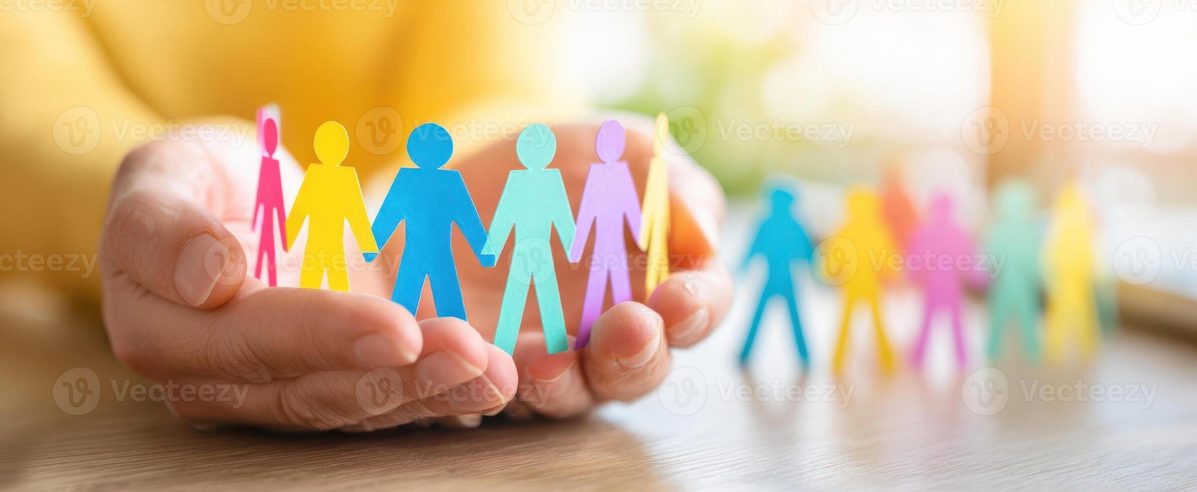 The colorful paper figures symbolizing unity and connection in a supportive community. photo
