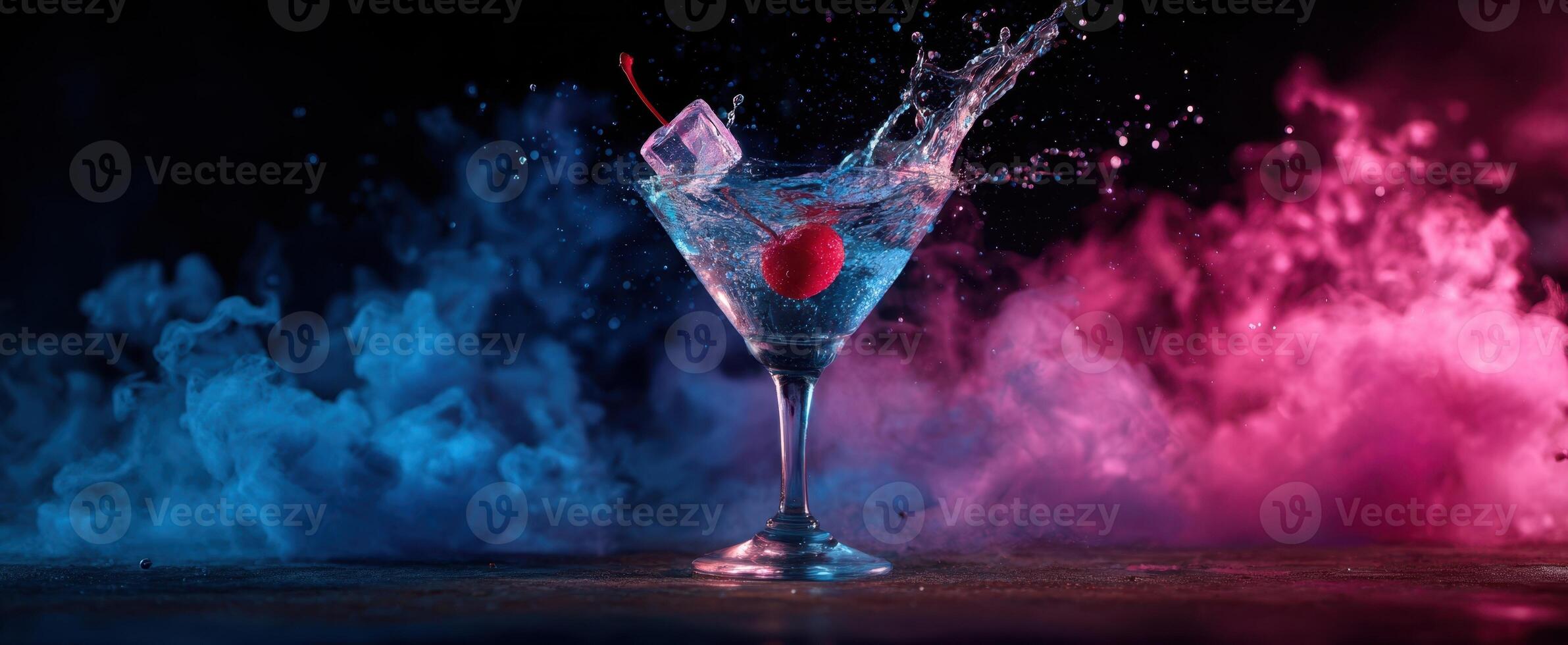 The refreshing cocktail splash in a vibrant blue and pink atmosphere. photo