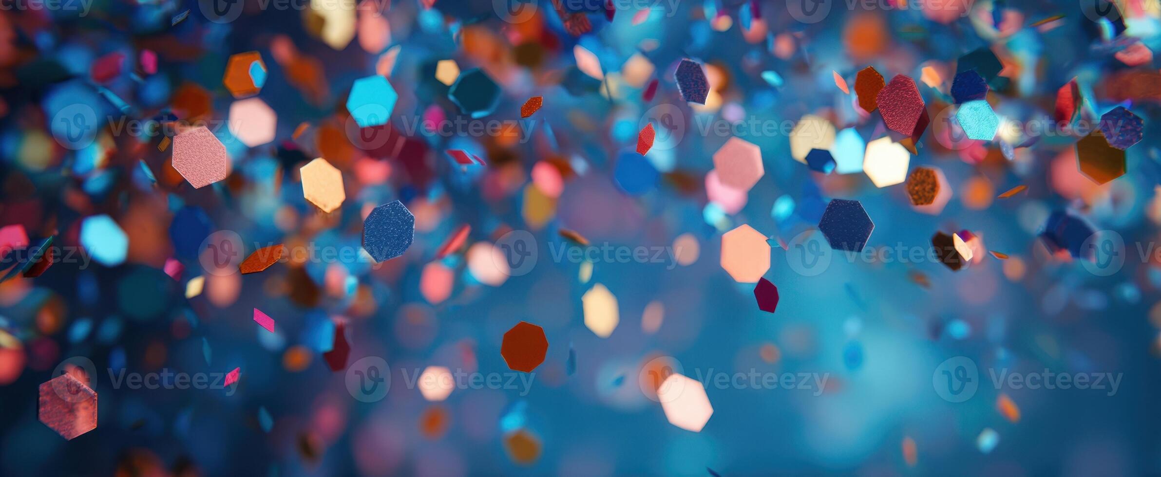 The Colorful Confetti Floating Through a Shimmering Blue Background photo