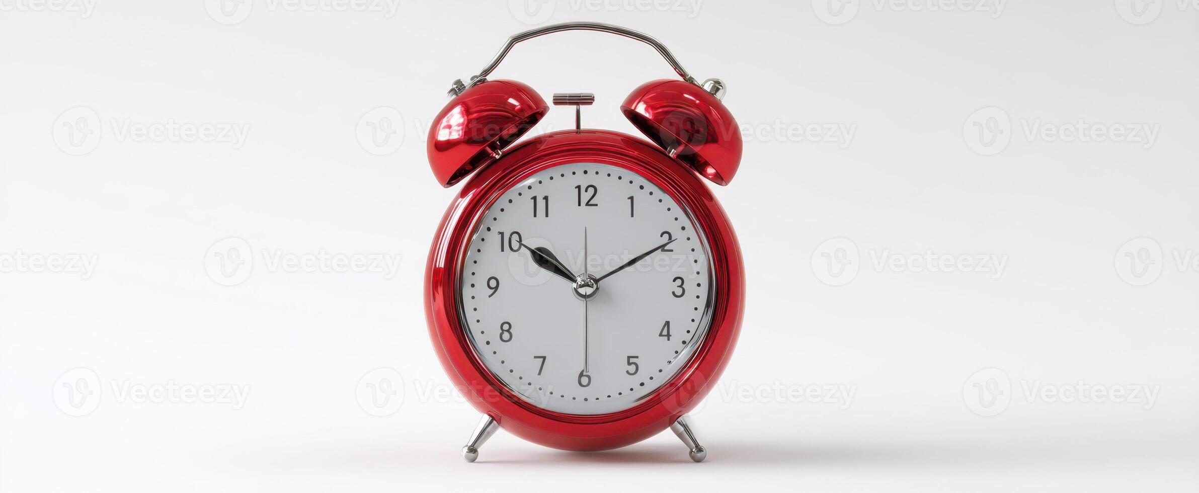The classic red alarm clock symbolizing time and punctuality. photo