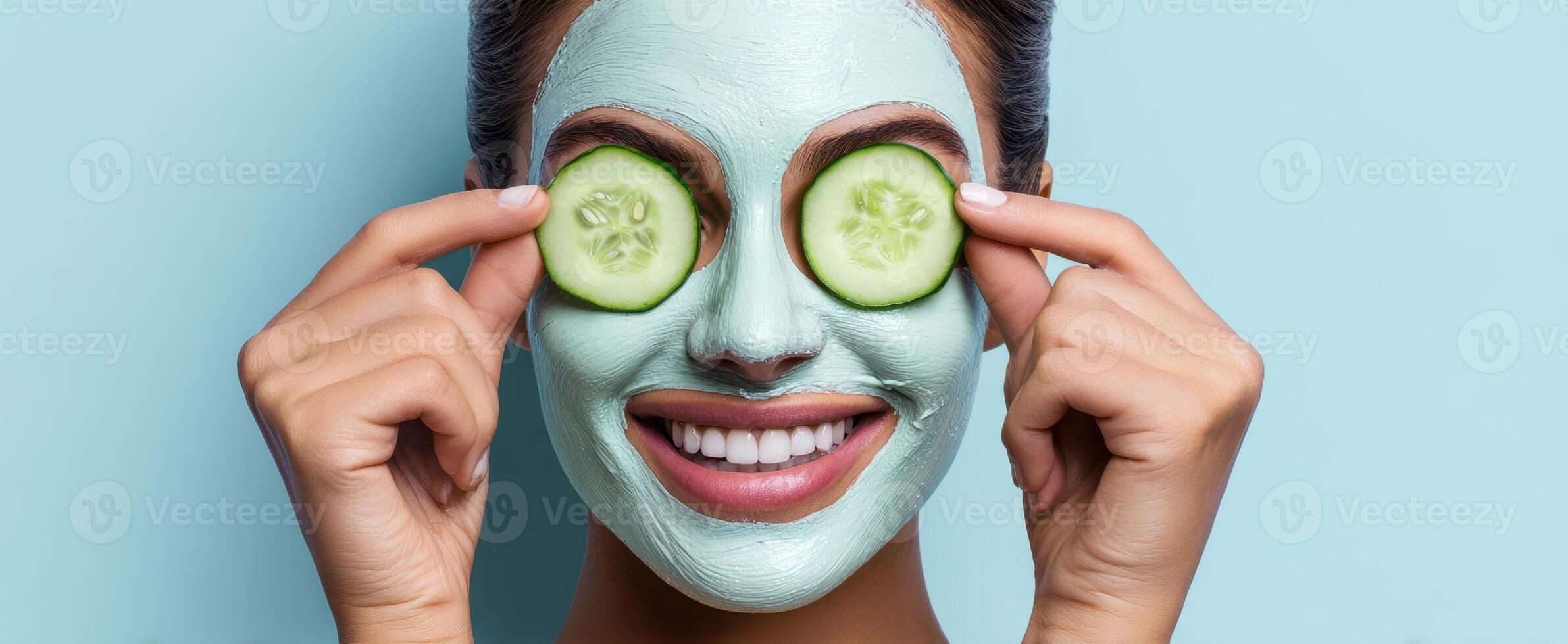The woman enjoying a refreshing facial mask with cucumber slices on her eyes. photo
